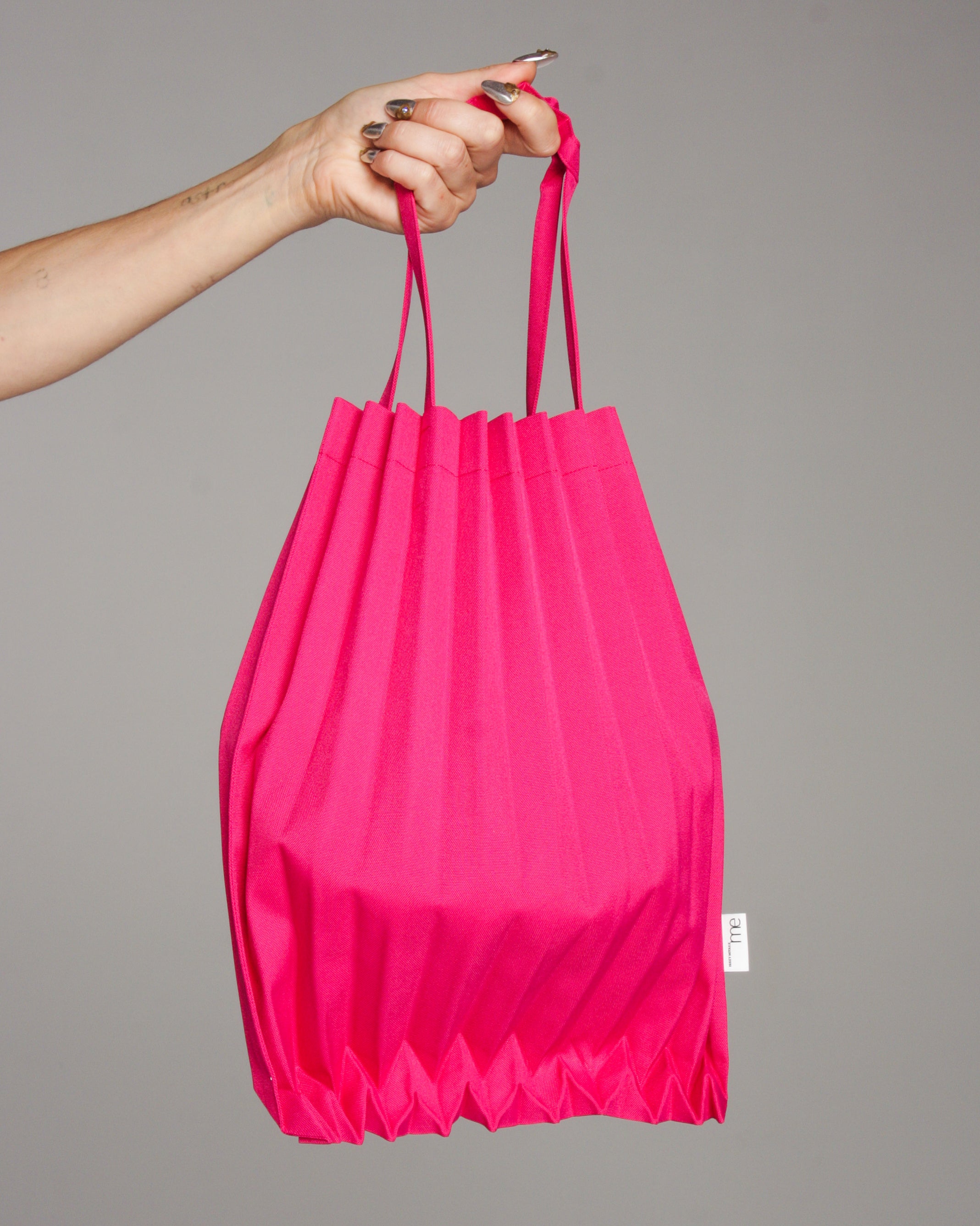 Accordion Pleats Tote in Neon Pink by Pleats Please Issey Miyake